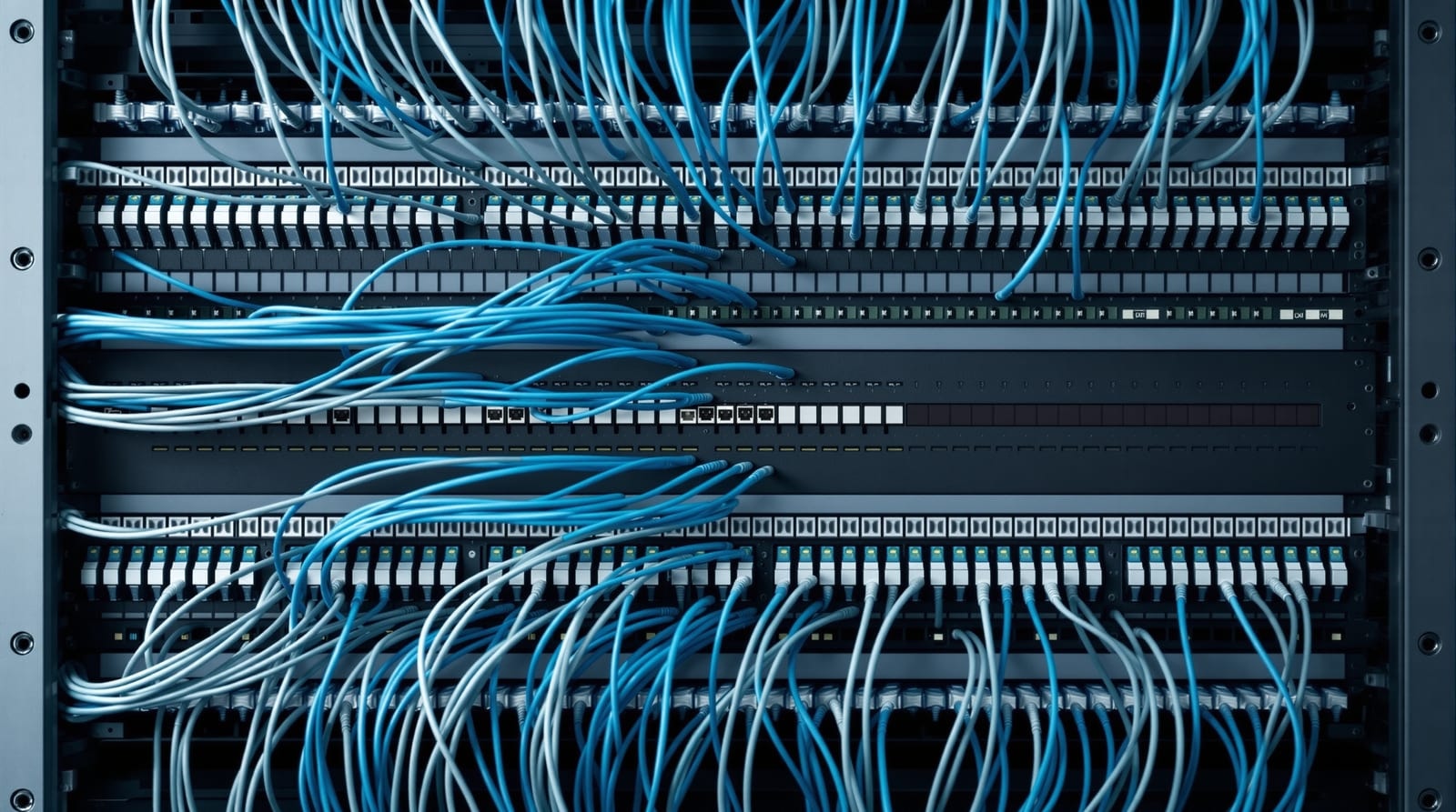 Ordered parallel cable runs leaving a patch panel, each following its own separate path